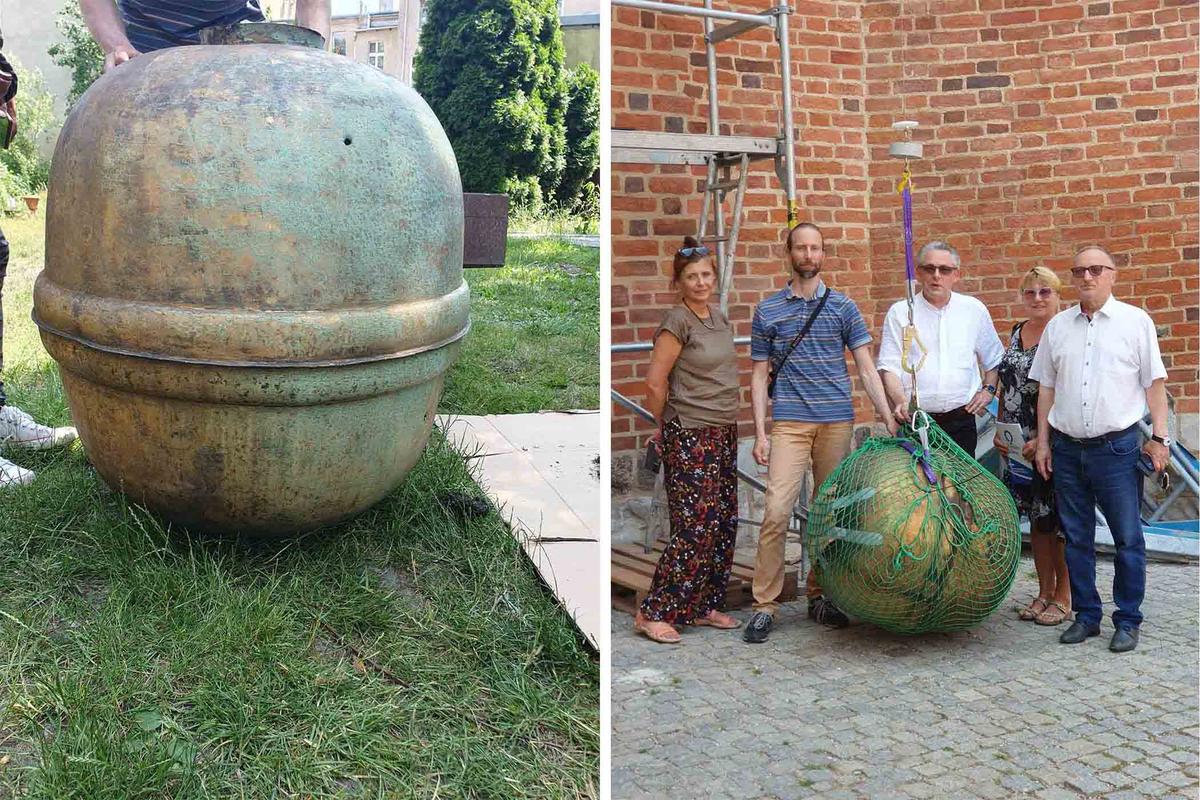 Museum of Wschowa Land researchers in Poland are photographed with the large copper orb containing what they believe to be the world's oldest time capsule outside St. Stanislaus Church. (Courtesy of Halina Drgas)