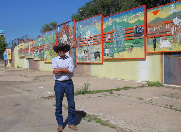 Rock Ulibarri stands in front of “The People’s History of El Norte,” an 11-panel chronology of Las Vegas mural he designed and was then vividly painted by some 300 high school students. (Mary Ann Anderson/TNS)