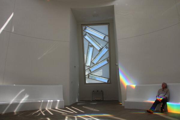 The Dwan Light Sanctuary at United World College in Montezuma near Las Vegas uses light, prisms, and rainbows to create an atmosphere of serenity and peace. Here, Las Vegas resident Frank Beurskens enjoys a moment of quiet reflection. (Mary Ann Anderson/TNS)