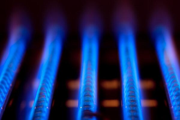  The blue flames of natural gas burning inside a boiler furnace in a file photo. (Dmitry Naumov/Shutterstock)