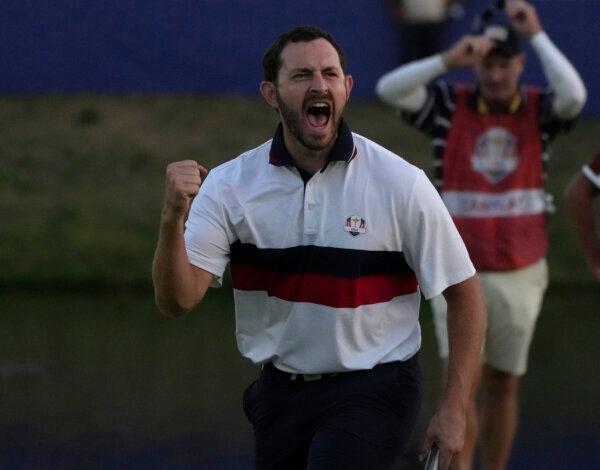  United States' Patrick Cantlay celebrates after holeing his putt on the 18th green to win the afternoon Fourballs match by 1 at the Ryder Cup golf tournament at the Marco Simone Golf Club in Guidonia Montecelio, Italy, on Sept. 30, 2023. (Alessandra Tarantino/AP Photo)