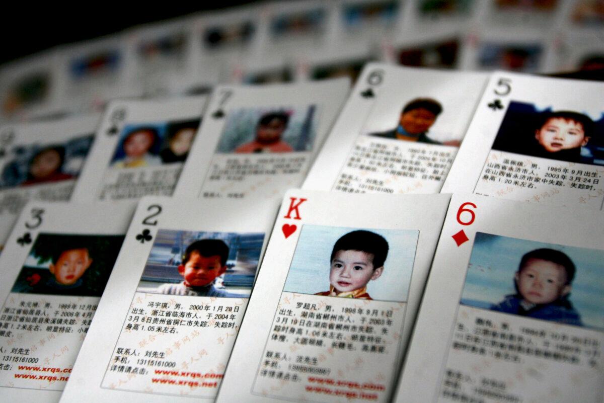 Playing cards showing details of missing children are displayed on March 31, 2007 in Beijing, China. (China Photos/Getty Images)