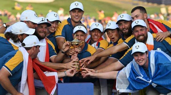  Luke Europe's English captain, Luke Donald (C) poses with The Ryder Cup and his players at the presentation ceremony following the final day of play in the 44th Ryder Cup at the Marco Simone Golf and Country Club in Rome on Oct. 1, 2023. (Paul Ellis/AFP via Getty Images)