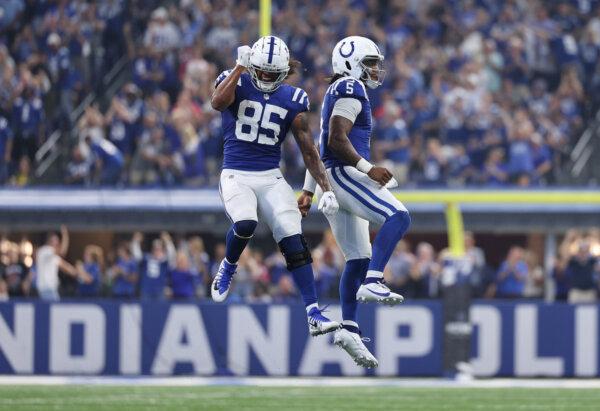  Anthony Richardson (5) of the Indianapolis Colts and Drew Ogletree (85) of the Indianapolis Colts celebrate a two-point conversion to tie the game against the Los Angeles Rams during the fourth quarter at Lucas Oil Stadium in Indianapolis on Oct. 1, 2023. (Michael Hickey/Getty Images)