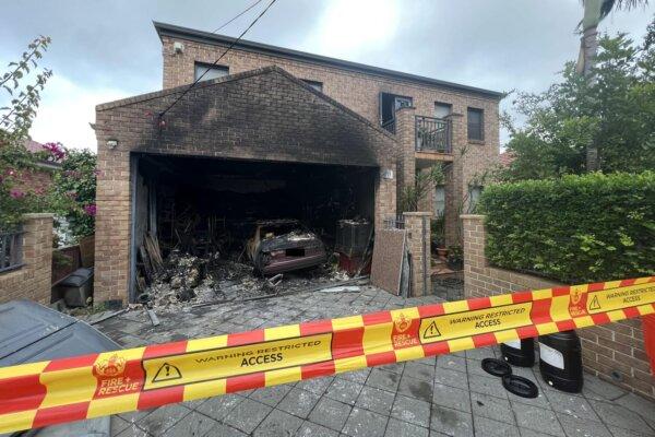 A burnt out garage following an explosion caused by an e-bike charging in Sydney, Australia, on March 20, 2023. (AAP Image/Supplied by Fire and Rescue NSW)