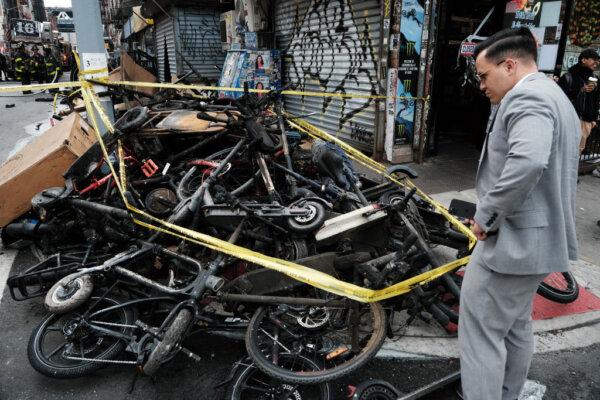 Charred remains of e-bikes and scooters sit outside of a building in New York City, on June 20, 2023. (Spencer Platt/Getty Images)