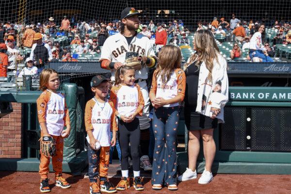 Brandon Crawford (35) of the San Francisco Giants stands with his family before a baseball game against the Los Angeles Dodgers at Oracle Park in San Francisco on Oct. 1, 2023. (Brandon Vallance/Getty Images)