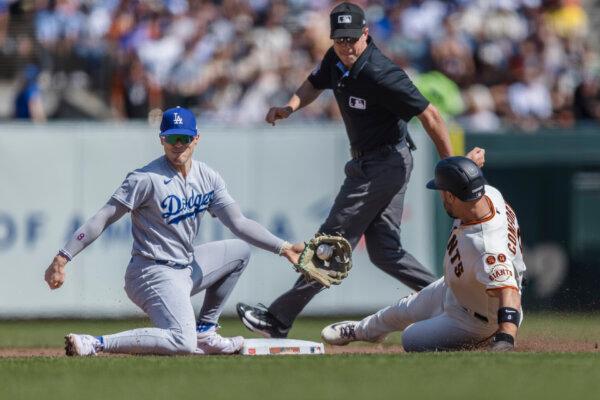 Dodgers get past Giants 5–2 for another 100-win season