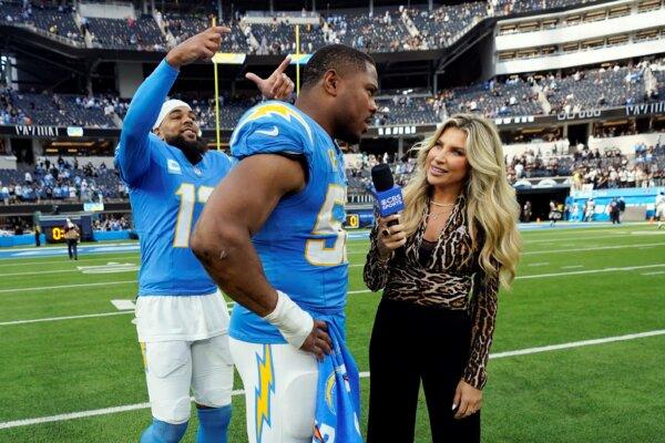 Los Angeles Chargers wide receiver Keenan Allen (L), jokes with linebacker Khalil Mack (C), as Mack conducts a post-game interview with CBS Sports after an NFL football game in Inglewood, Calif., on Oct. 1, 2023. (Ashley Landis/AP Photo)