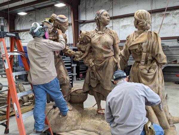 “We observed workers getting any little nubs and marks ground and torched off,” said Claire Suminski, on the board with Folk Heritage Association of Macon County in Franklin, N.C., watch the final processes that the sculpture, "Sowing the Seeds of the Future" underwent. (Claire Suminski)