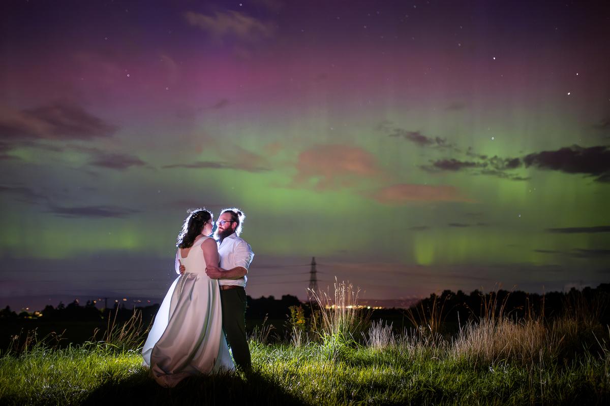 Ms. MacDonald and Mr. Oman on their wedding day under the Northern Lights. (SWNS)