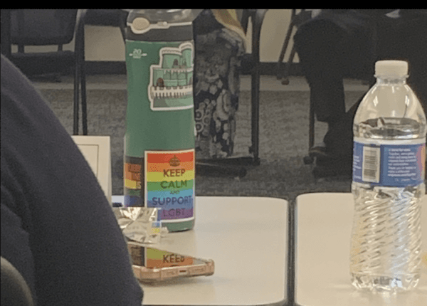 A member of the Fairfax County Public Schools Family Life Education Curriculum Advisory Committee has a water bottle with a sticker that says "Keep Calm and Support LGBT" in Fairfax County, Va., on Sept. 11, 2023. (Masooma Haq/The Epoch Times)