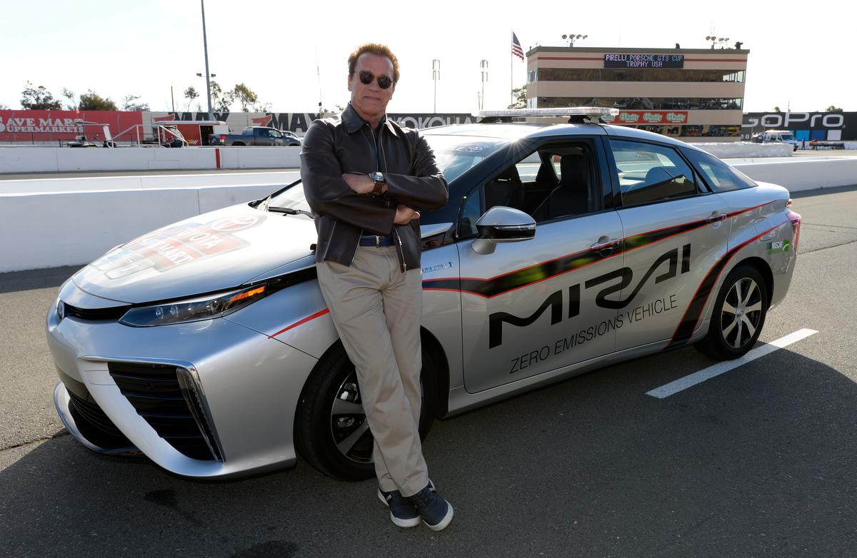 Actor and former governor of California Arnold Schwarzenegger poses with the 2016 Toyota Mirai pace car, a hydrogen fuel-cell electric vehicle, on pit road prior to the NASCAR Sprint Cup Series Toyota/Save Mart 350 at Sonoma Raceway in Sonoma, Calif., on June 28, 2015. (Robert Laberge/Getty Images)