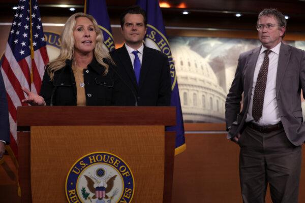 (L) Rep. Marjorie Taylor Greene (R-Ga.) speaks as (C) Rep. Matt Gaetz (R-Fla.) and (R) Rep. Thomas Massie (R-Ky.) listen during a news conference at the Capitol, on Nov. 17, 2022. (Alex Wong/Getty Images)