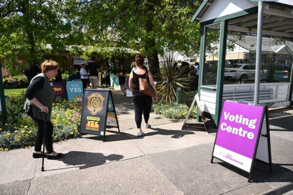 AEC and Vote Yes signage at an early voting centre for the Indigenous voice to parliament referendum in Melbourne, Australia, on Oct. 2, 2023. (AAP Image/Joel Carrett)