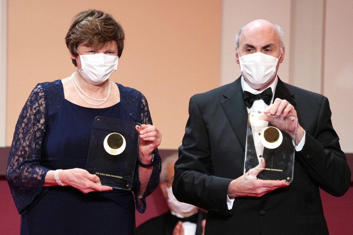 Japan Prize 2022 laureates Hungarian-American biochemist Katalin Kariko (L) and U.S. physician-scientist Dr. Drew Weissman pose with their trophy during the presentation ceremony in Tokyo on April 13, 2022. (Eugene Hoshiko/Pool/AFP via Getty Images)