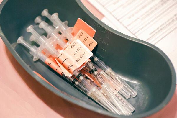Syringes filled with COVID-19 vaccine sit on a table at a COVID-19 vaccination clinic in a file image. (Justin Sullivan/Getty Images)