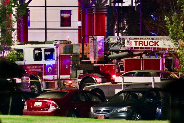 A Baltimore City Fire Department truck stages at Morgan State University during a shooting on the campus, in Baltimore, on Oct. 3, 2023. (Jerry Jackson/The Baltimore Sun via AP)