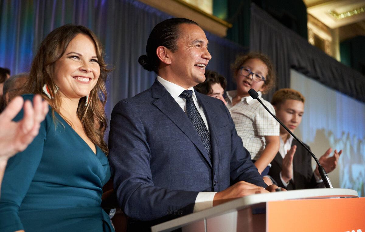 Manitoba NDP leader Wab Kinew delivers his victory speech, alongside his wife Lisa Monkman, after winning the Manitoba provincial election in Winnipeg, Man., on Oct. 3, 2023. (The Canadian Press/David Lipnowski)