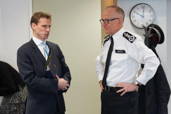 Policing minister Chris Philp (L) talks to Metropolitan Police Commissioner Sir Mark Rowley (R) at a meeting of the National Policing Board at the Home Office in London on Nov. 30, 2022. (PA)