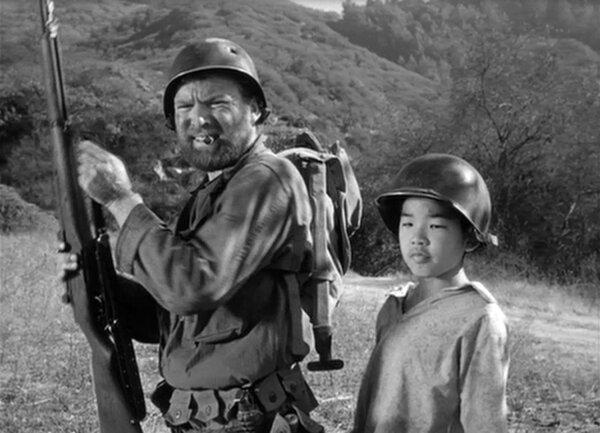 Sgt. Zack (Gene Evans, L) and his new sidekick Short Round (William Chun), in “The Steel Helmet.” (Lippert Pictures)