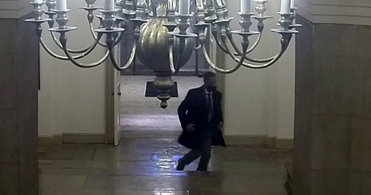 Capitol Police security video shows Special Agent David Lazarus at the bottom of the Rotunda stairs at 2:56 p.m. on Jan. 6, 2021. (U.S. Capitol Police/Screenshot via The Epoch Times)