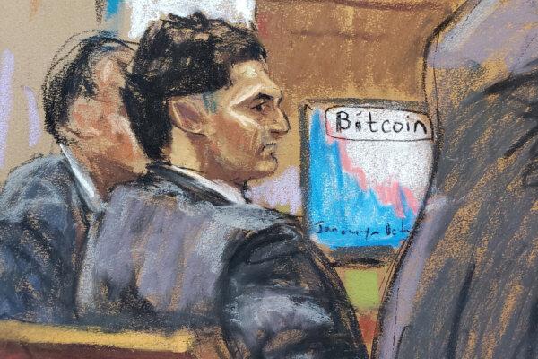 In this courtroom sketch, Sam Bankman-Fried watches as defense lawyer Mark Cohen makes his opening remarks in Mr. Bankman-Fried's fraud trial over the collapse of FTX, the bankrupt cryptocurrency exchange, at Federal Court in New York City, on Oct. 4, 2023. (Jane Rosenberg/Reuters)