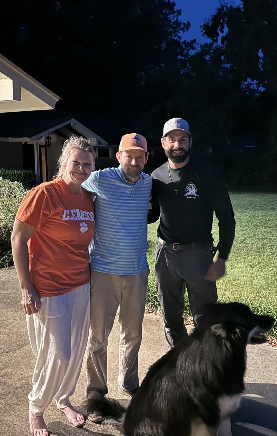 Amber Lowder (L), Jim Lowder (C), and Matt Perella (R) pose with Raffe at the Lowders' home in Sumter, N.C., on Sept. 28, 2023. (Courtesy of Jim Lowder)