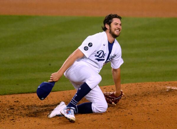 Trevor Bauer (27) of the Los Angeles Dodgers reacts after a line drive single from Eric Hosmer (30) of the San Diego Padres during the sixth inning at Dodger Stadium in Los Angeles on April 24, 2021. (Harry How/Getty Images)