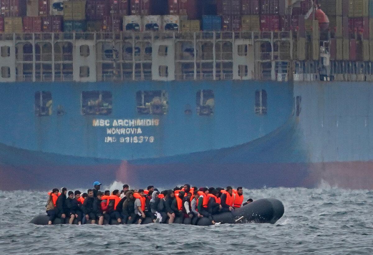 A group of illegal immigrants in a small boat travelling France and heading in the direction of Dover, England, on Aug. 29, 2023. (Gareth Fuller/PA)
