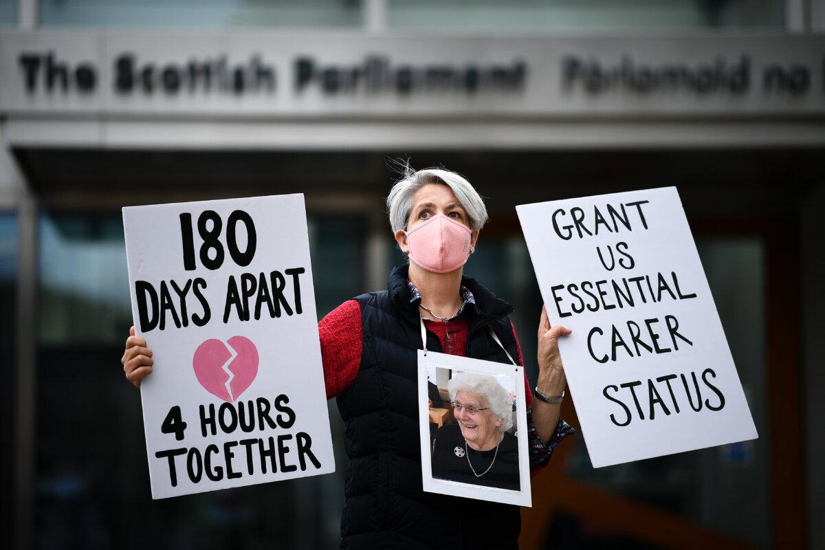 Relatives stage a demonstration over care home COVID-19 visiting rules outside the Scottish Parliament in Edinburgh, Scotland, on Sept. 16, 2020. (Jeff J Mitchell/Getty Images)