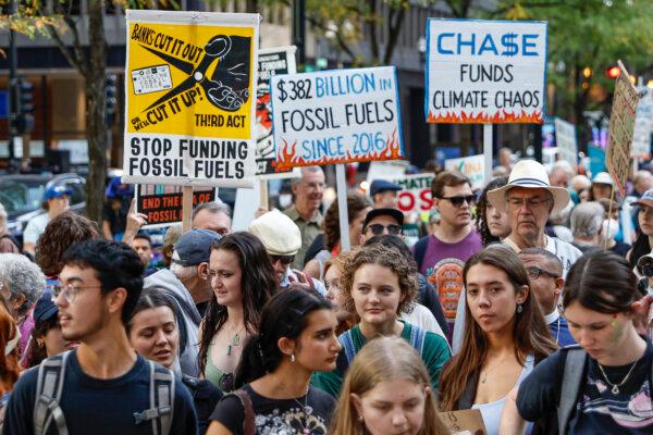 Environmental activists march during the Global Climate Strike in downtown Chicago, Illinois, on September 15, 2023. (Photo by KAMIL KRZACZYNSKI/AFP via Getty Images)