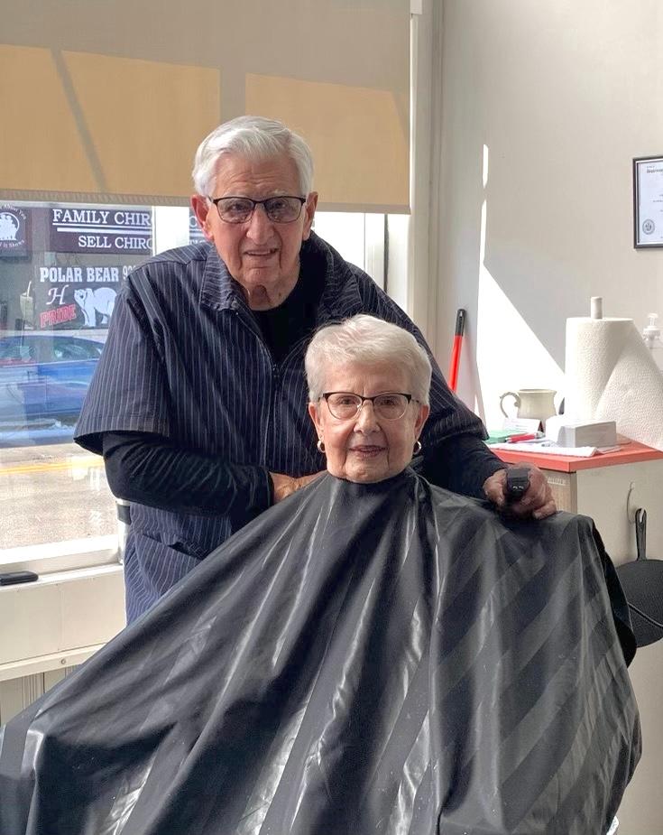 Mr. Rohloff styling his wife’s hair on his 91st birthday. (Courtesy of Mark Karweick)