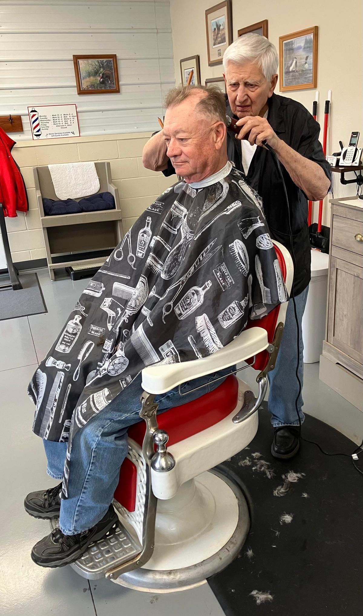 Mr. Rohloff cutting a customer's hair in 2023. (Courtesy of Mark Karweick)