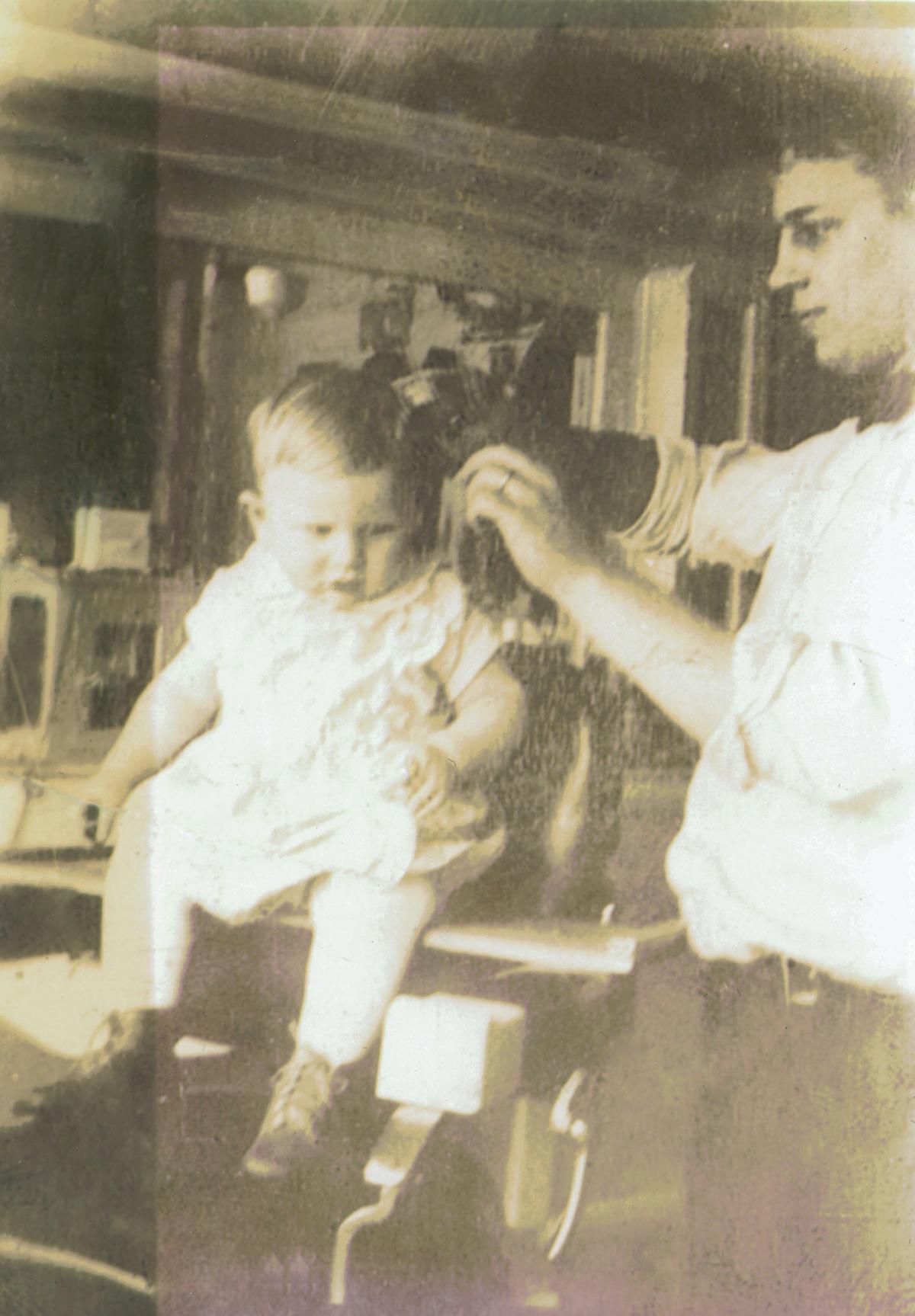 Robert Rohloff's father giving him a haircut in 1929. (Courtesy of Mark Karweick)