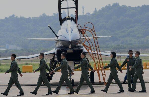 Pilots of Chengdu Aircraft Corp.'s J-10 for the People's Liberation Army Air Force (PLAAF) march after performing a flight demonstration program at the 13th China International Aviation and Aerospace Exhibition in Zhuhai, Guangdong Province, China, on Sept. 28, 2021. (NOEL CELIS/AFP via Getty Images)