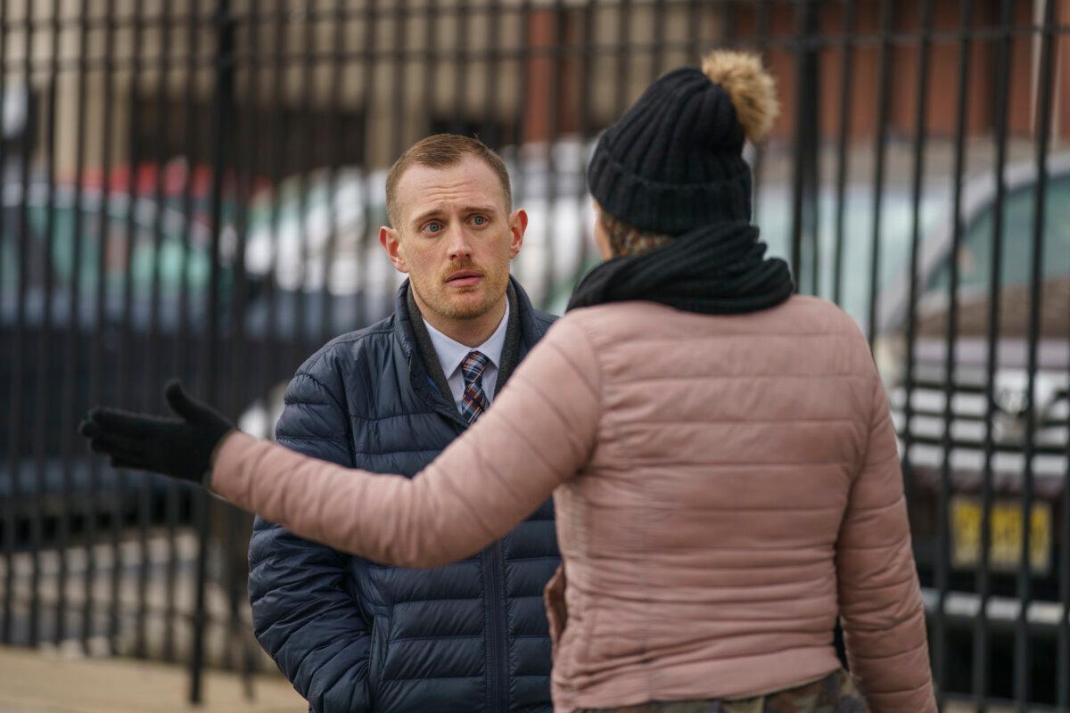 Josh Kruger (L), then communications director of the Office of Homeless Services at City of Philadelphia, at a tent encampment in Philadelphia on Jan. 6, 2020. (Jessica Griffin/The Philadelphia Inquirer via AP)