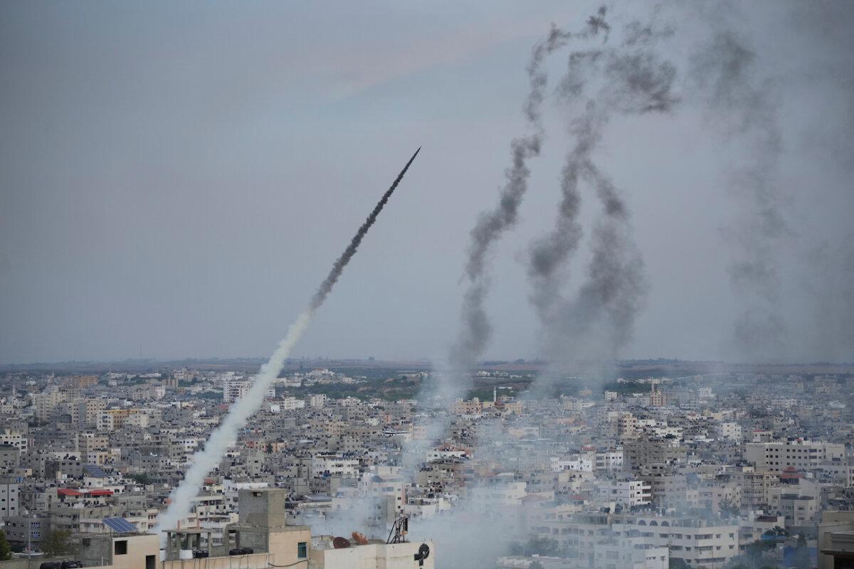 Rockets are launched by Hamas terrorists from the Gaza Strip towards Israel, in Gaza, on Oct. 7, 2023. (AP Photo/Hatem Moussa)