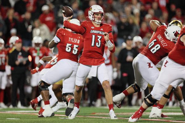 Jack Plummer (13) of Louisville Cardinals runs with the ball against the Notre Dame Fighting Irish at L&N Stadium in Louisville, Ky., on Oct. 7, 2023. (Andy Lyons/Getty Images)