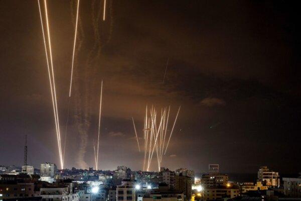 A salvo of rockets is fired by Palestinian militants from Gaza City toward Israel on Oct. 7, 2023. (Eyad Baba/AFP via Getty Images)