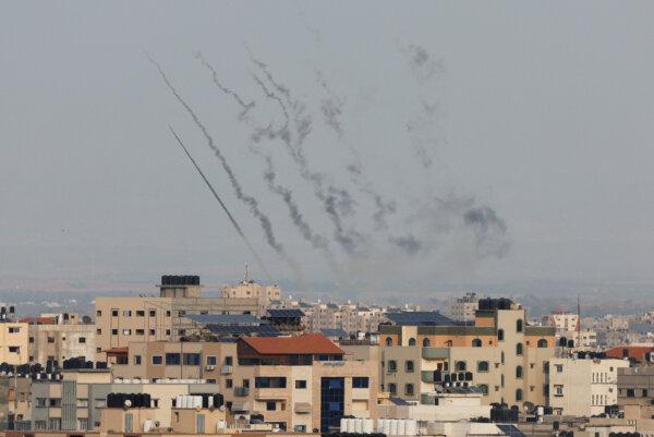 Rockets are fired from Gaza toward Israel, in the Gaza Strip on Oct. 8, 2023. (Mohammed Salem/Reuters)