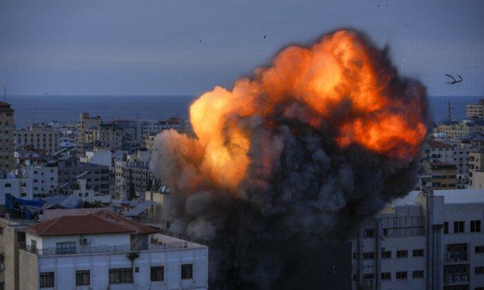 Fire and smoke rise following an Israeli airstrike, in Gaza City, on Oct. 8, 2023. (Hatem Moussa/The Canadian Press/AP)