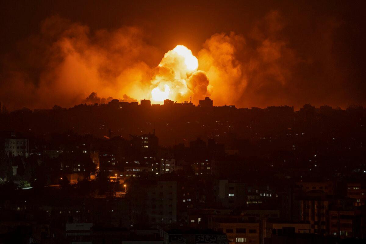 Fire and smoke rise following an Israeli airstrike, in Gaza City on Oct. 8, 2023. (Fatima Shbair/AP Photo)
