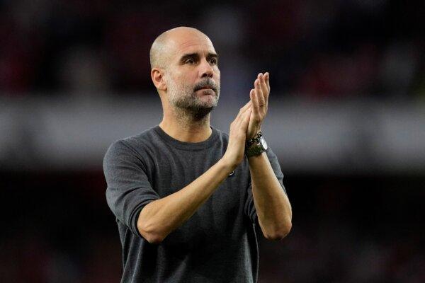 Manchester City's head coach Pep Guardiola applauds to supporters after his team lost the English Premier League soccer match between Arsenal and Manchester City at the Emirates Stadium in London, on Oct. 8, 2023. (Kirsty Wigglesworth/AP Photo)