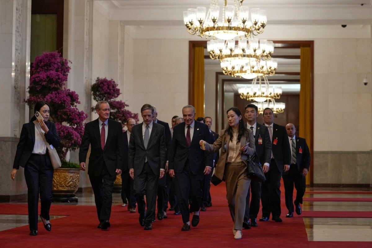 U.S. Senate Majority Leader Chuck Schumer (center R) and his delegation walk to a bilateral meeting with Chinese leader Xi Jinping in Beijing on Oct. 9, 2023. (Andy Wong /AFP via Getty Images)