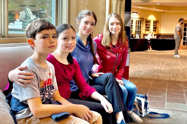 (L–R) Siblings Nicholas, 9, Mary Alice, 11, Lillian, 14, and Francine, 17, attend “The Miracle of Man” conference at Covenant Fellowship Church, in Glen Mills, Pa., on Sept. 30, 2023. (Kay Rubacek for The Epoch Times)
