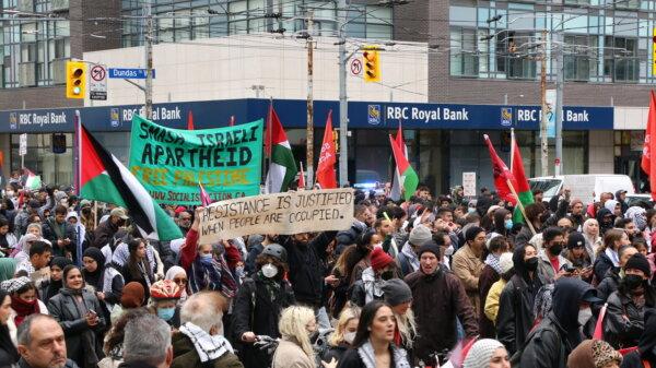 Pro-Palestinian protesters march along Bay Street in downtown Toronto on Oct. 9, 2023. (Andrew Chen/The Epoch Times)