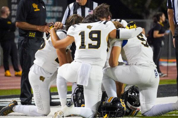 Members of Capistrano Valley High School's football team kneel on the field in Aliso Viejo, Calif., on Oct. 6, 2023. (Courtesy of Monica Acosta)