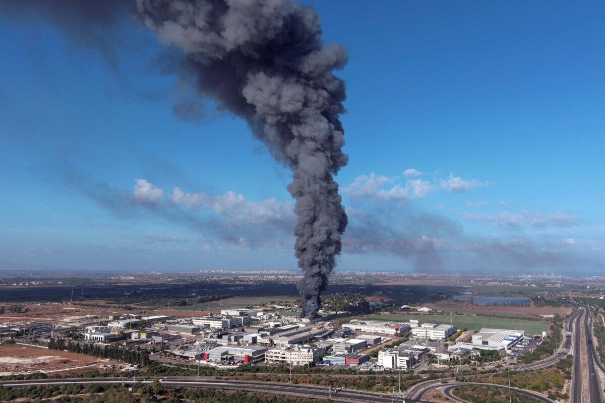 Smoke is seen in the Rehovot area as rockets are launched from the Gaza Strip into Israel on Oct. 7, 2023. (Ilan Rosenberg/Reuters)