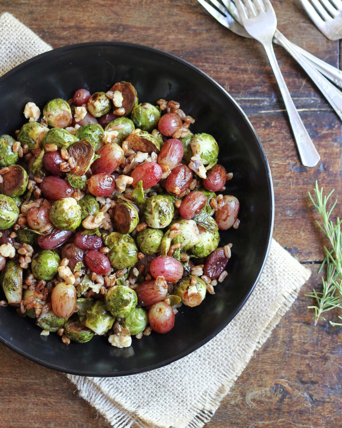 This hearty bowl tosses Brussels sprouts with grapes, toasted walnuts, and a cooked grain. (Lynda Balslev for Tastefood)